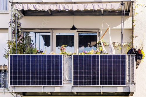 Solar Panel on Balcony of Modern Apartment Building. Modern Balcony with Solar Panels, Marquise and Garden photo