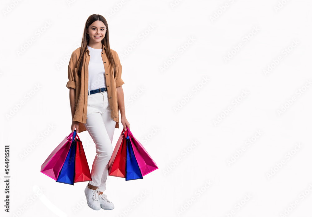 photo of shopper girl after shop, copy space. teen girl shopper with shop bag isolated on white photo of shopper girl after shop, copy space. teen girl shopper with shop bag isolated on white