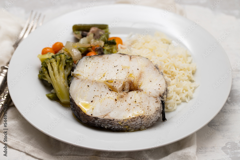 baked vegetables with boiled fish on white plate baked vegetables with boiled fish on white plate