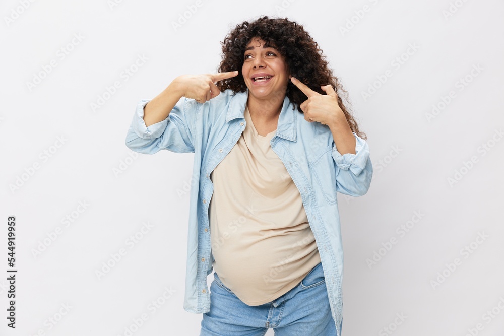 Pregnant woman smile and happiness, big belly before childbirth, Mother's Day white isolated background in T-shirt with blue shirt Pregnant woman smile and happiness, big belly before childbirth, Mother's Day white isolated background in T-shirt with blue shirt