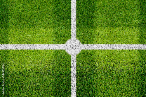 Top view of the white Line marking on the artificial green grass center soccer field.