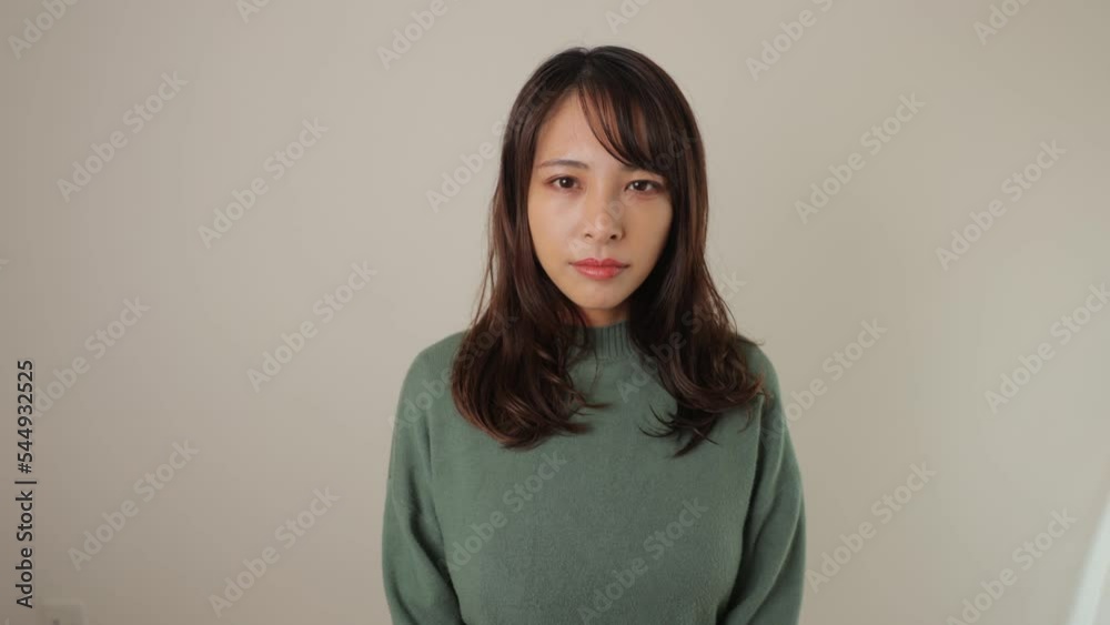 Beautiful asian woman opens her eyes. White wall. Dolly out. Strong will. Beautiful asian woman opens her eyes. White wall. Dolly out. Strong will.