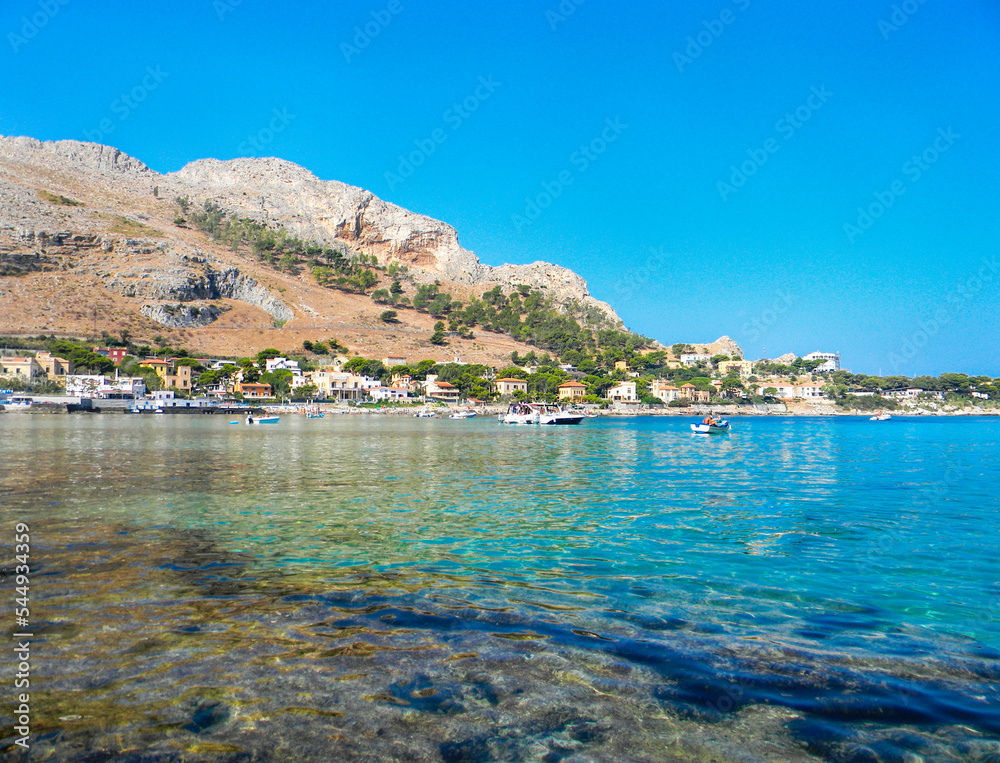 Fototapeta premium Sferracavallo, Province of Palermo, Sicily, Italy. With rocky coast and blue sea, coastal stones and nobody. Here on a sunny day.