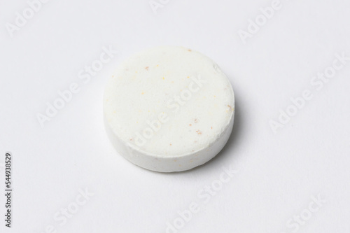 Close-up white medicine pills on white background