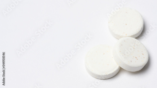 Close-up white medicine pills on white background