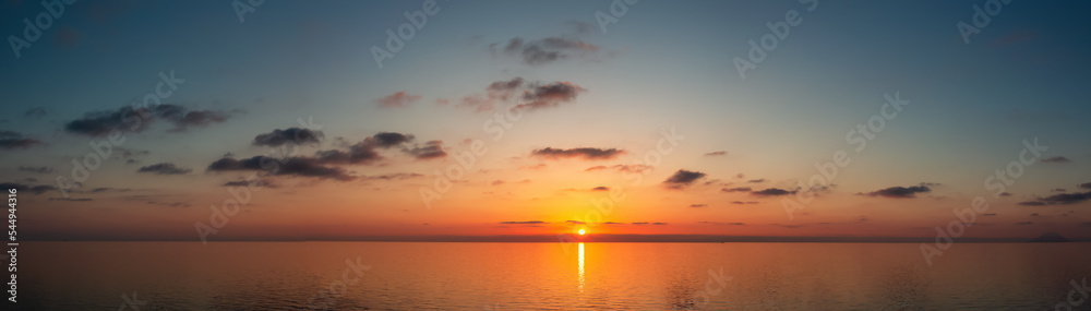 Dramatic Colorful Sunset Sky over Mediterranean Sea. Cloudscape Nature Background. Panorama