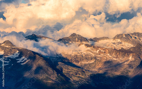 Dramatic clouds above the Glockner Group of the Hohe Tauern range in Austrian alps.