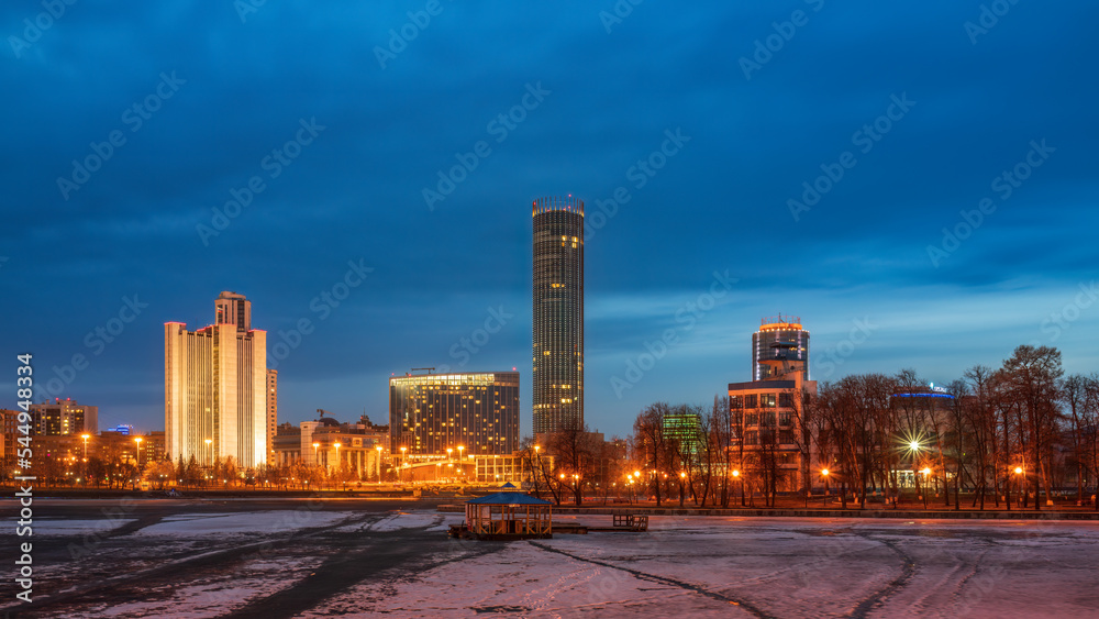 Early Spring night on the banks of the pond in the city center Early Spring night on the banks of the pond in the city center