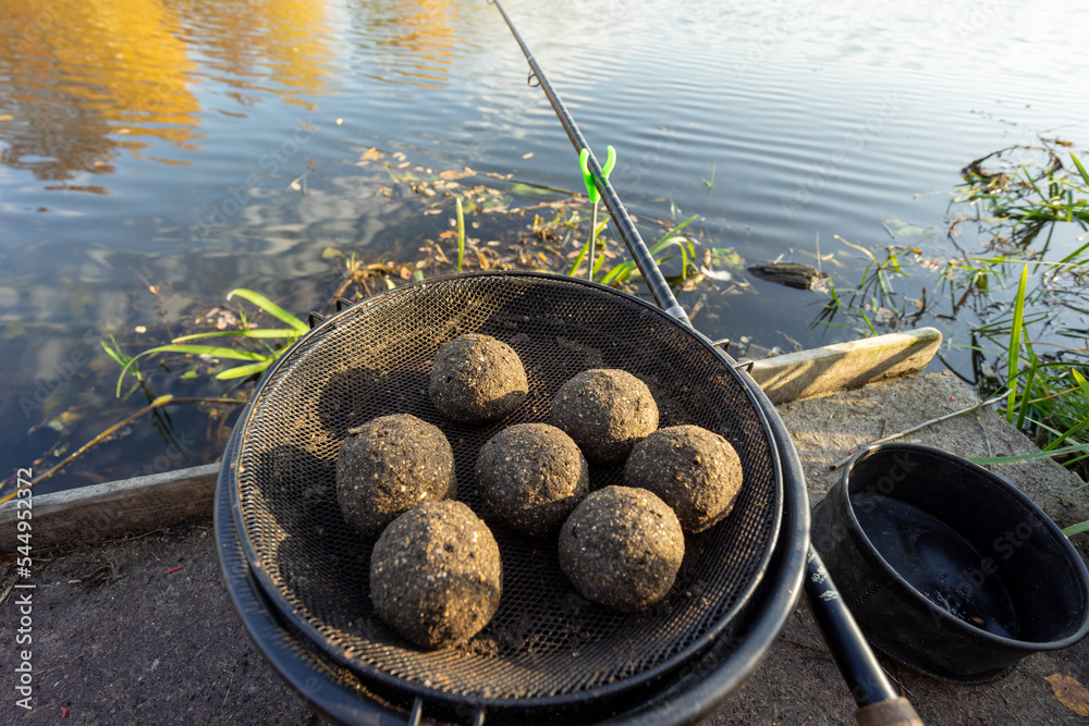 Groundbait balls ready for baiting fish. Fishing groundbait. Kule