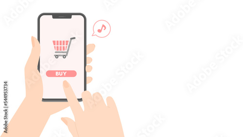 ショッピングカートとBUYの文字が表示されているスマホを持つ人の手 - 買い物･ネットショッピングのイメージ素材
