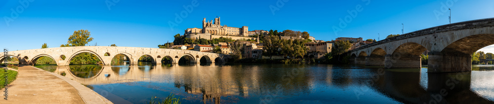 Old bridge over the Orb river and Saint Nazaire cathedral in Béziers, Hérault, Occitanie, France