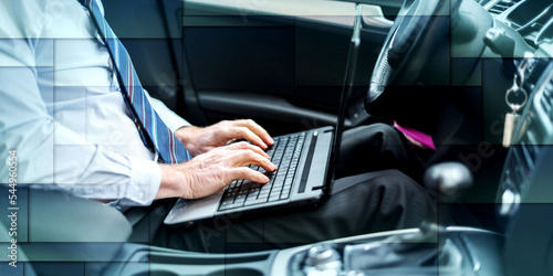 Businessman working in his car, geometric pattern