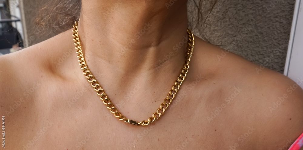 brown skin gold chain layered necklace elegant, simple jewelry set neck chest tanned skin sunshine glow black shirt dark skin shiny glow summer tan new jewelry online shopping influencer posing model 