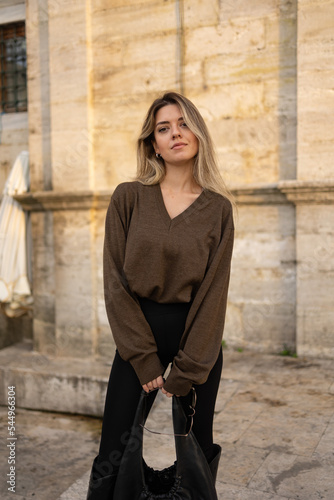 Young beautiful woman posing at outside. Portrait photo.