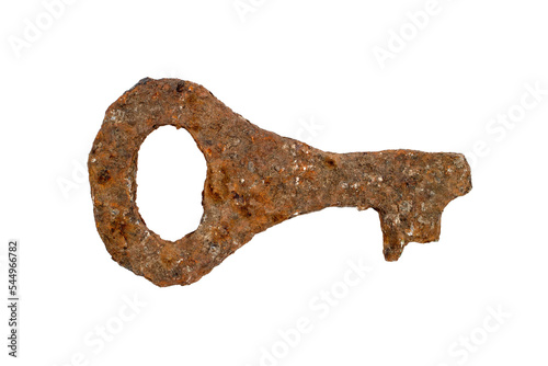 A strongly rusty key of the classical shape on a white background.