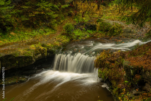 Hamersky creek with waterfalls in Luzicke mountains in color autumn day photo