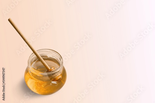 Fresh sweet organic honey in glass jar