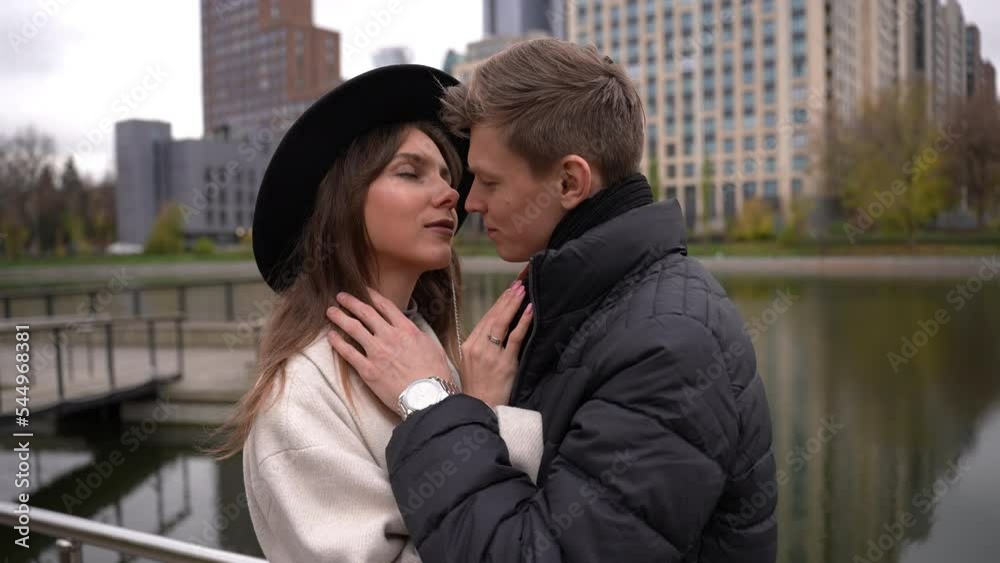 Kiss on the background of skyscrapers of a couple in love Kiss on the background of skyscrapers of a couple in love