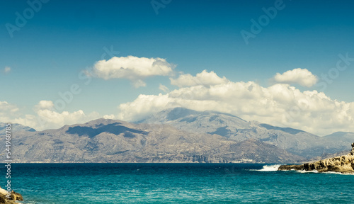 Scenic view of seascape and snowcapped mountain