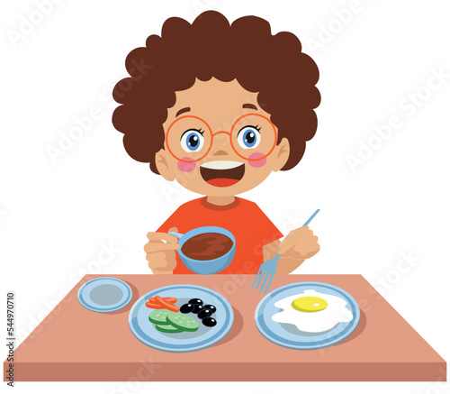 cute little boy having breakfast