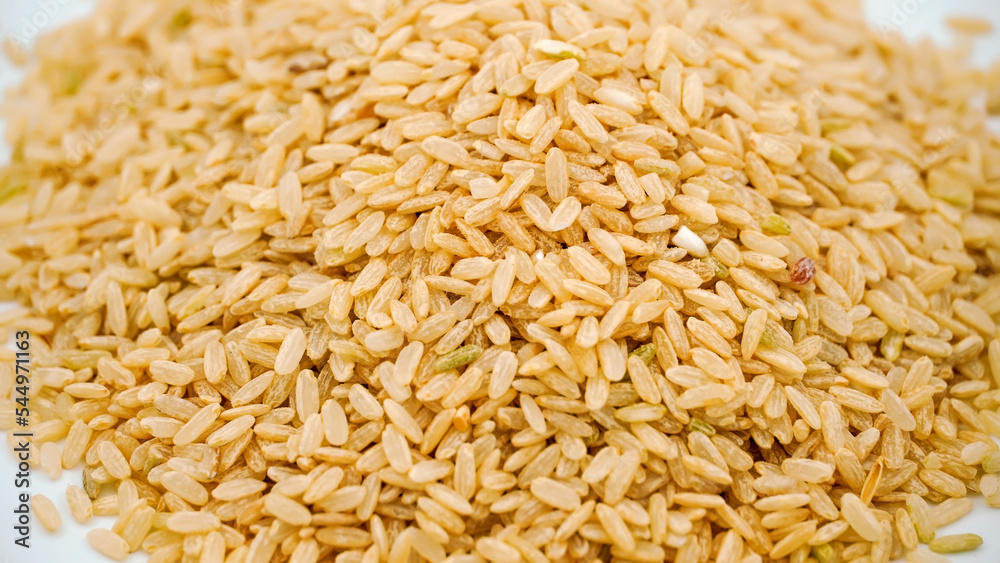 Brown rice - low carbohydrate on an isolated white background Brown rice - low carbohydrate on an isolated white background
