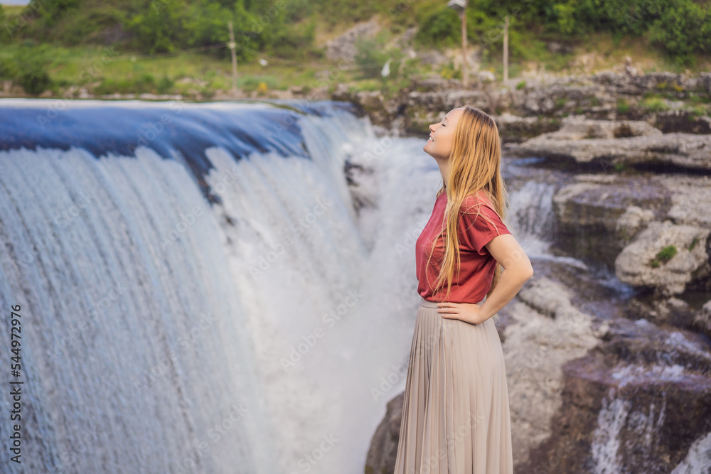 Obraz na płótnie Woman tourist on background of Picturesque Niagara Falls on the river Cievna. Montenegro, near Podgorica. Travel around Montenegro concept w salonie