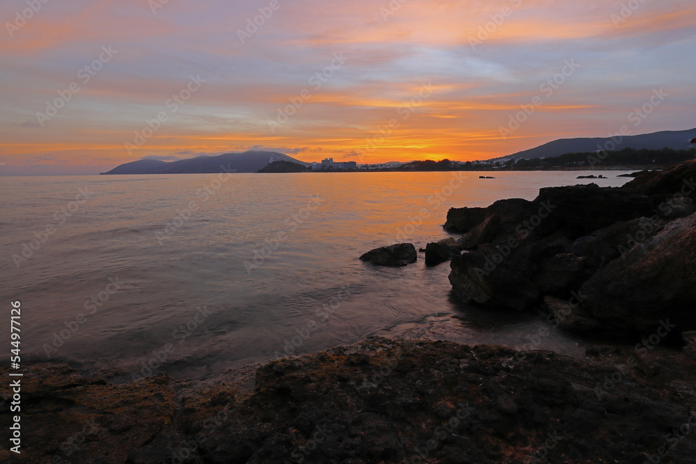 Obraz premium Sunset over Santa Eulalia from Cala Talamanca beach, Ibiza, Balearic Islands, Spain.