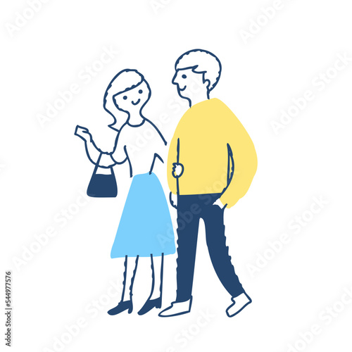 腕を組んで歩く若いカップル