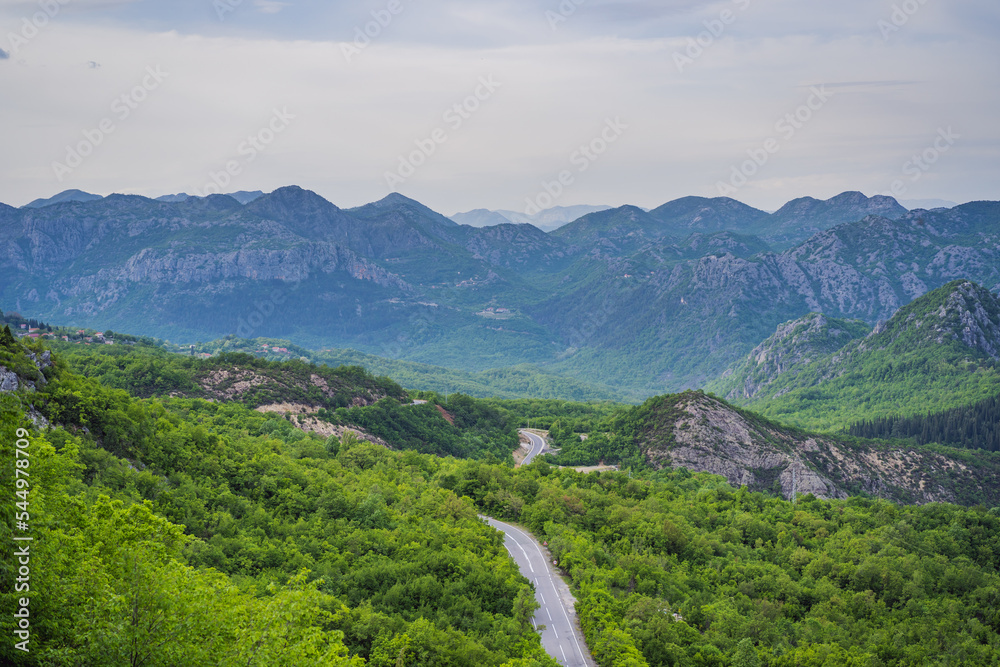 Montenegro. Picturesque canyon. Mountains surrounding the canyon. Forests on the slopes of the mountains. Haze over the mountains