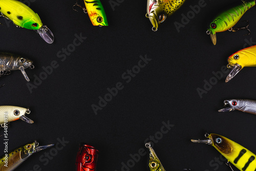 Lures for fishing on a black background photo