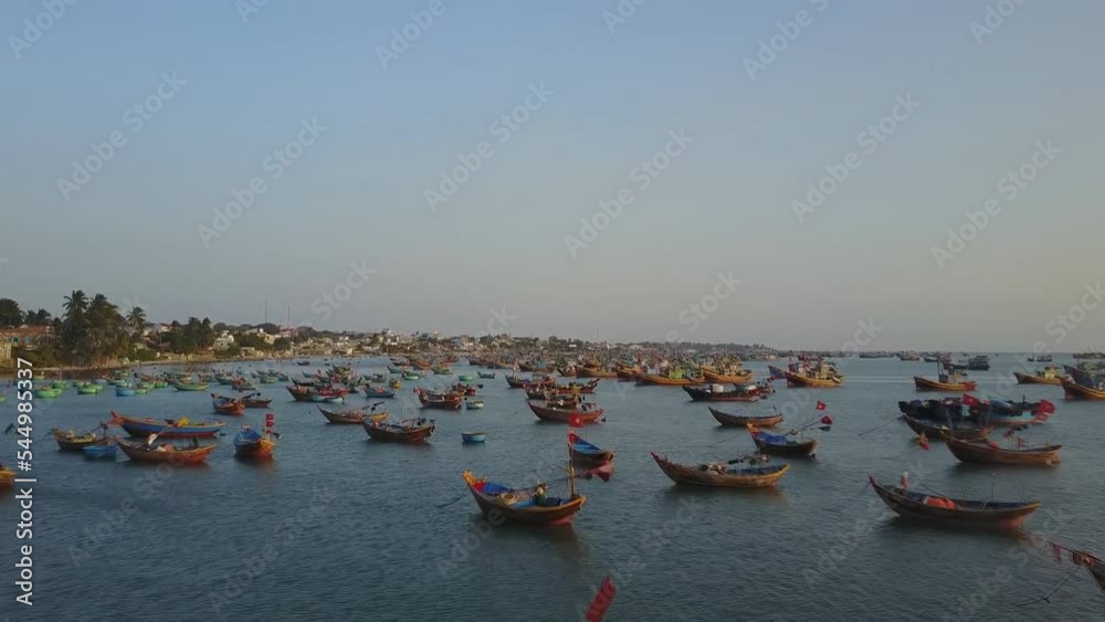 Aerial view of Vietnamese fishing village, Mui Ne, Vietnam, Southeast Asia. Landscape with sea and traditional colorful fishing boats. Aerial view of Vietnamese fishing village, Mui Ne, Vietnam, Southeast Asia. Landscape with sea and traditional colorful fishing boats.
