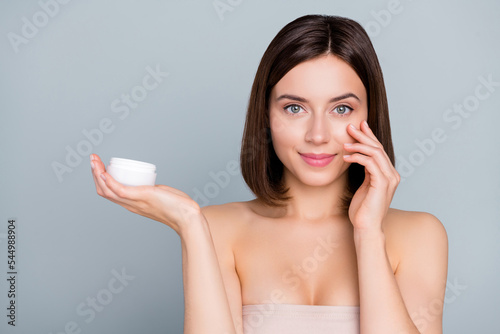 Papier peint Photo of happy lady beautician hold cream jar advertise skin peeling option touc