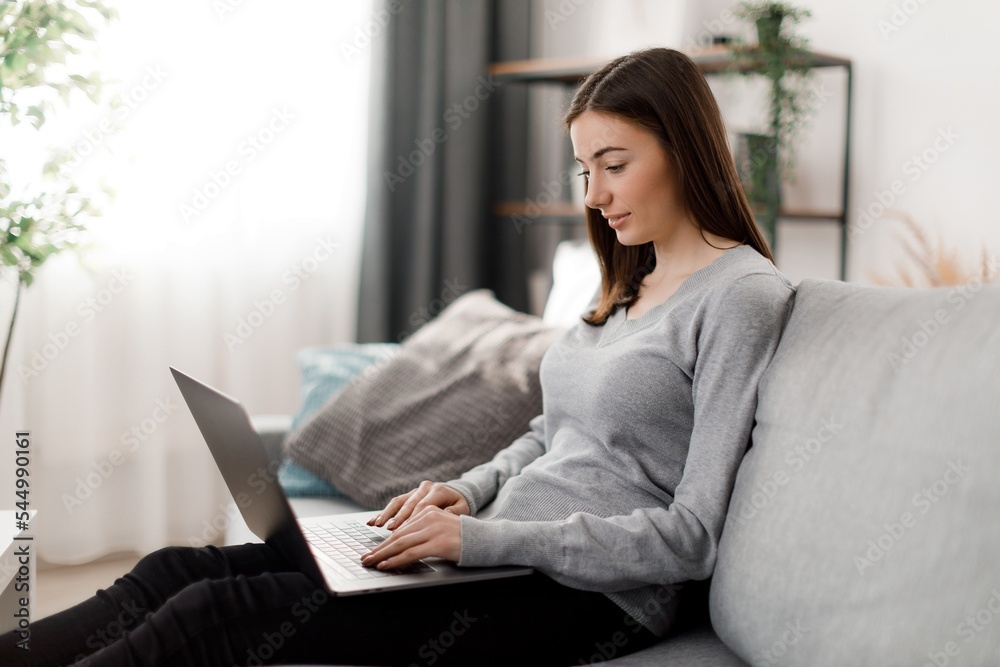 Woman at home with laptop Woman at home with laptop