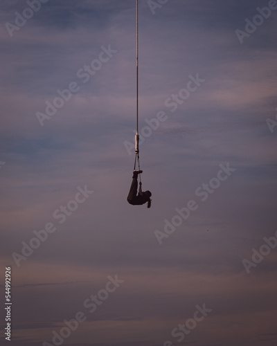silhouette of a hanging person