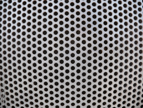 Close-up of round patterns on a radiator
