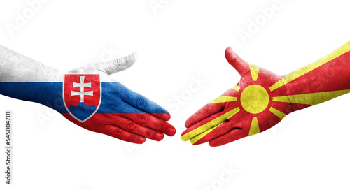 Handshake between North Macedonia and Slovakia flags painted on hands, isolated transparent image.