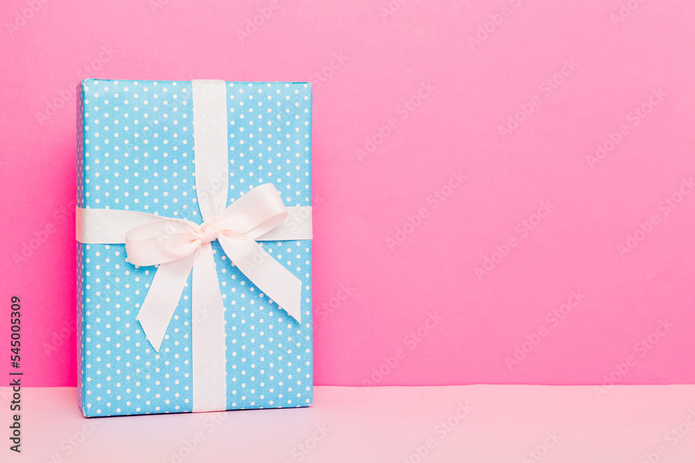 holiday handmade paper present tied white ribbon bow top view with copy space. Flat lay holiday background. Birthday or christmas present. Christmas gift box concept with copy space holiday handmade paper present tied white ribbon bow top view with copy space. Flat lay holiday background. Birthday or christmas present. Christmas gift box concept with copy space
