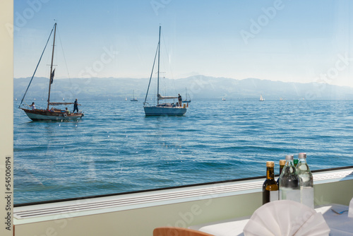 Bodenseeschifffahrt, Schifffahrt am Bodensee mit Blick auf die Schweizer Berge photo