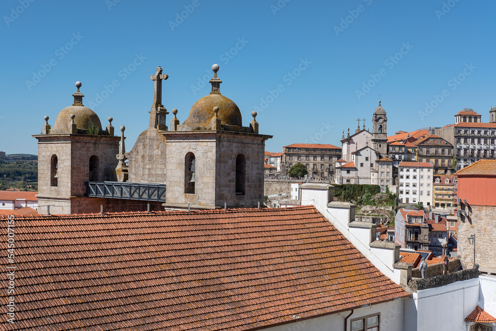 The rooftop of the church and convent Igreja dos Grijos, and surrounding old buildings and monuments as seen from the lookout Terreiro da Se, near the cathedral in Porto, Portugal