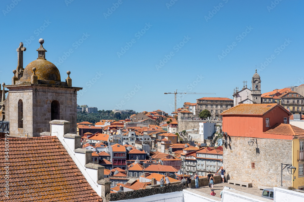 Panoramic views that stretch across the city from the lookout Terreiro da Se near the cathedral, including the iconic terracotta rooftops and historical buildings, in Porto, Portugal