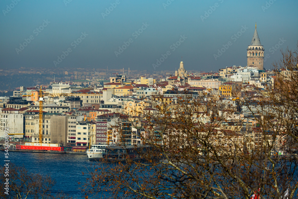View across Golden Horn bay of Galata Tower above residential buildings of Beyoglu district in Istanbul, Turkey