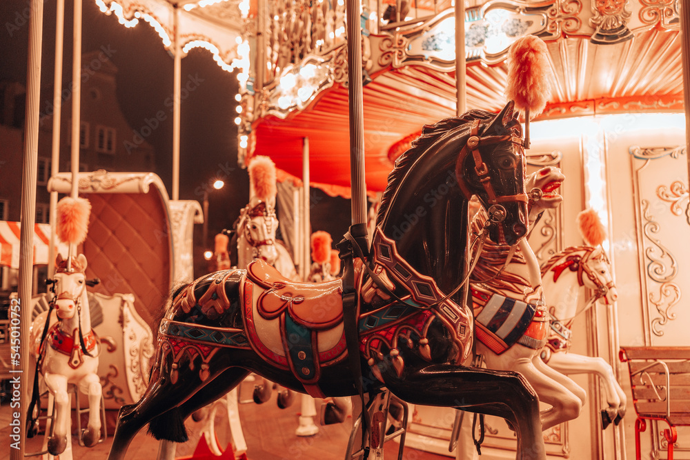  Three horses and a plane on a traditional fair carousel. Carousel with horses in Gdansk, Poland, Europe. 2024