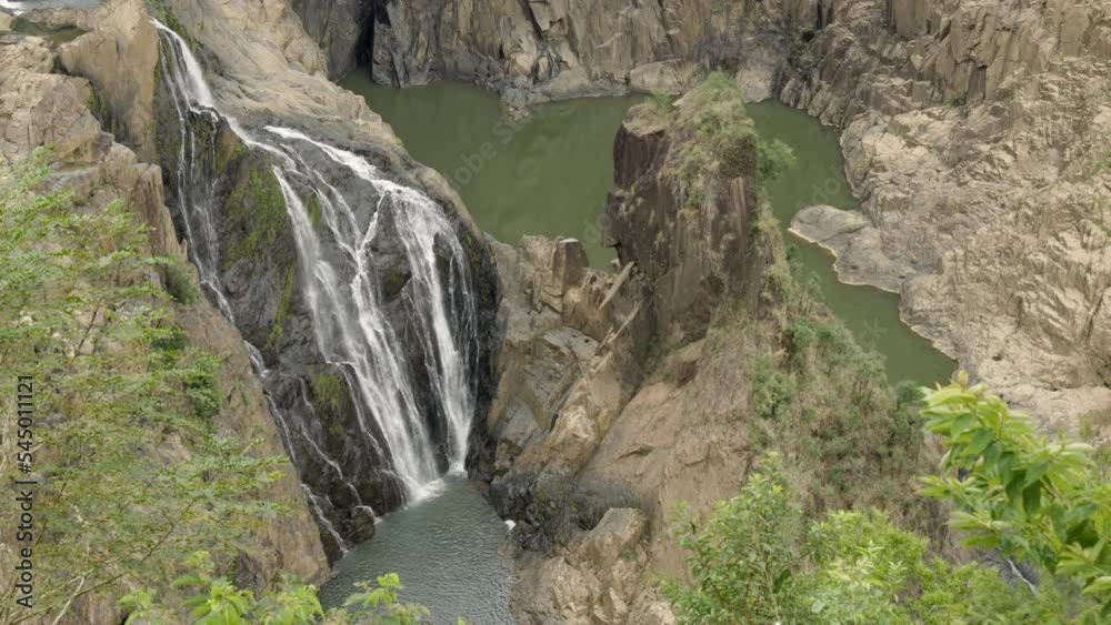 a zoom in on the base of barron falls during the dry season at kuranda in north qld, australia a zoom in on the base of barron falls during the dry season at kuranda in north qld, australia