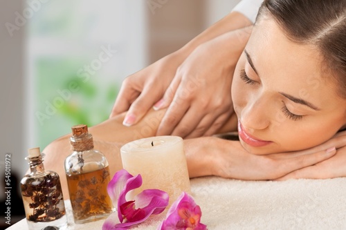 Young beautiful happy woman on massage therapy