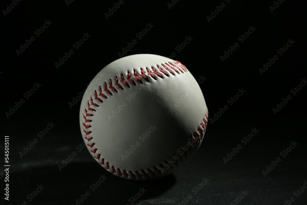 Baseball ball on black background. Sports game Baseball ball on black background. Sports game