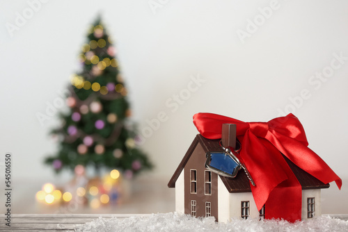 Model of house with key and...