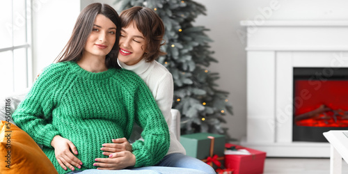 Young pregnant lesbian with...