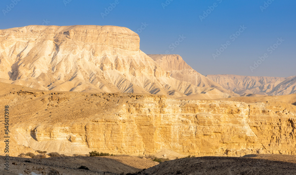 Gorgeous aerial drone top bird's eye view of incredible golden desert mountains of tzin river. desert in Israel Gorgeous aerial drone top bird's eye view of incredible golden desert mountains of tzin river. desert in Israel