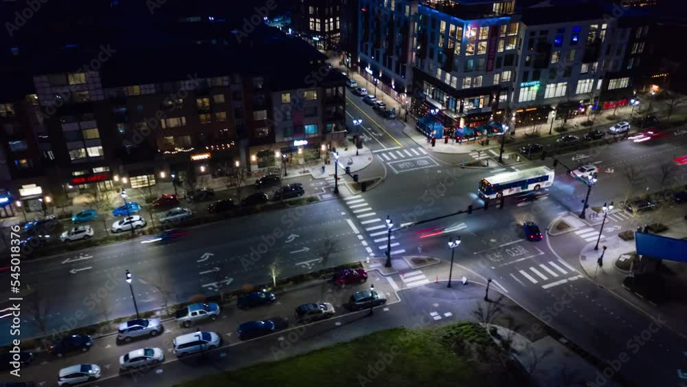A futuristic aerial hyperlapse across the recently developed downtown of a small city.