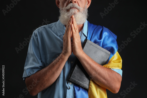 Mature man with flag of Ukr...